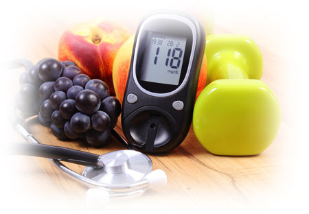 Blood sugar monitor with healthy food, exercise equipment and stethoscope